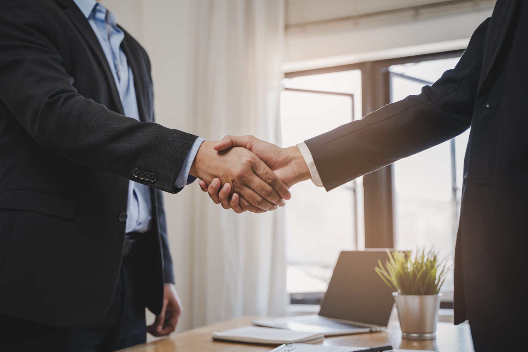A handshake representing a business support partnership