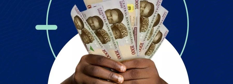 Hands holding Nigerian naira notes, representing a loan disbursement